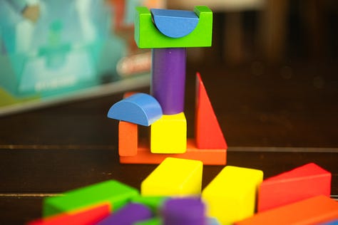 Spirit Island, For Science!, and Through the Desert, each in varying states of play.