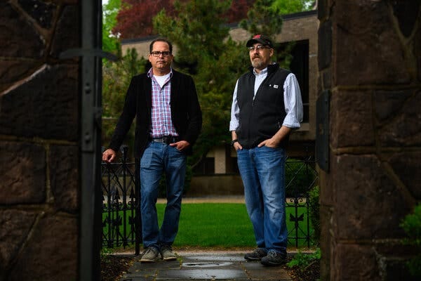 Dr. David Salas-de la Cruz and Dr. Paul Boxer of Rutgers University pose for a portrait on the campus of Rutgers University-Camden.