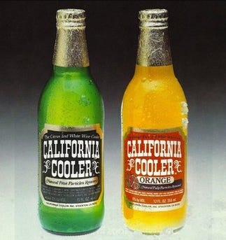 One green and one orange bottle of California Cooler