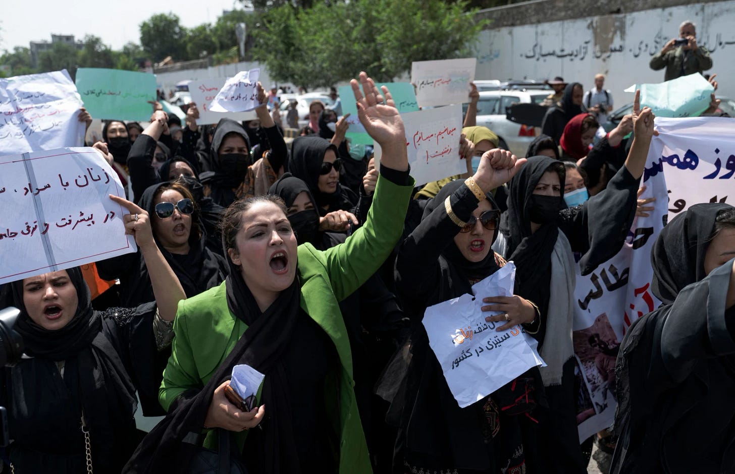 Afghan women hold placards as they march and shout slogans "Bread, work, freedom" during a womens' rights protest in Kabul on August 13, 2022. (File/AFP)