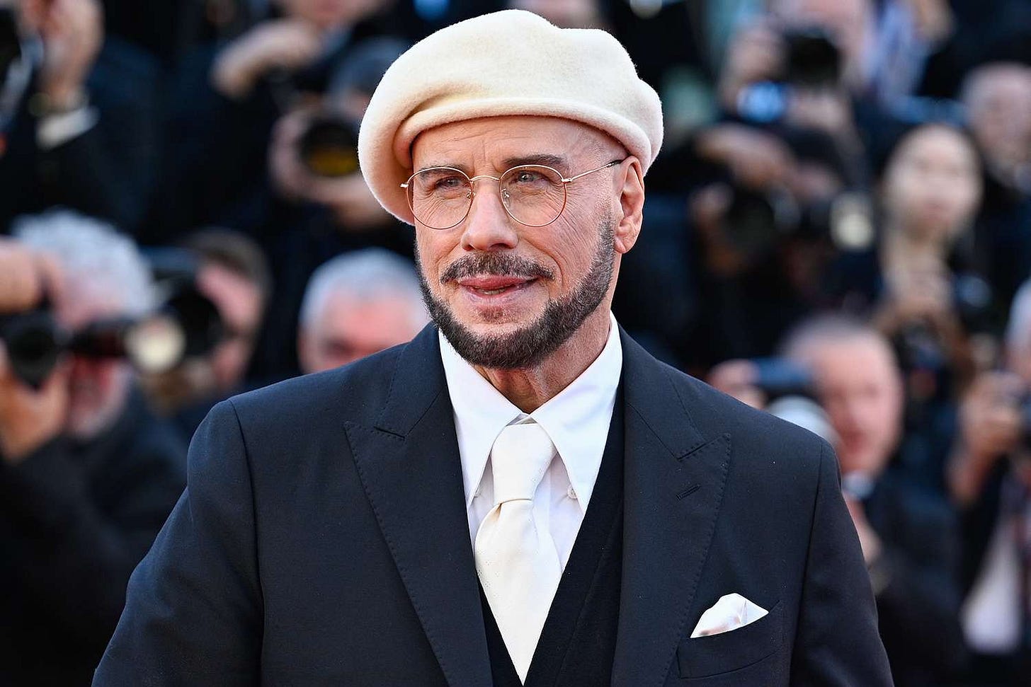 John Travolta Explains the Origin of His Viral Beret Look at Cannes John Travolta Explains the Origin of His Viral Beret Look at Cannes