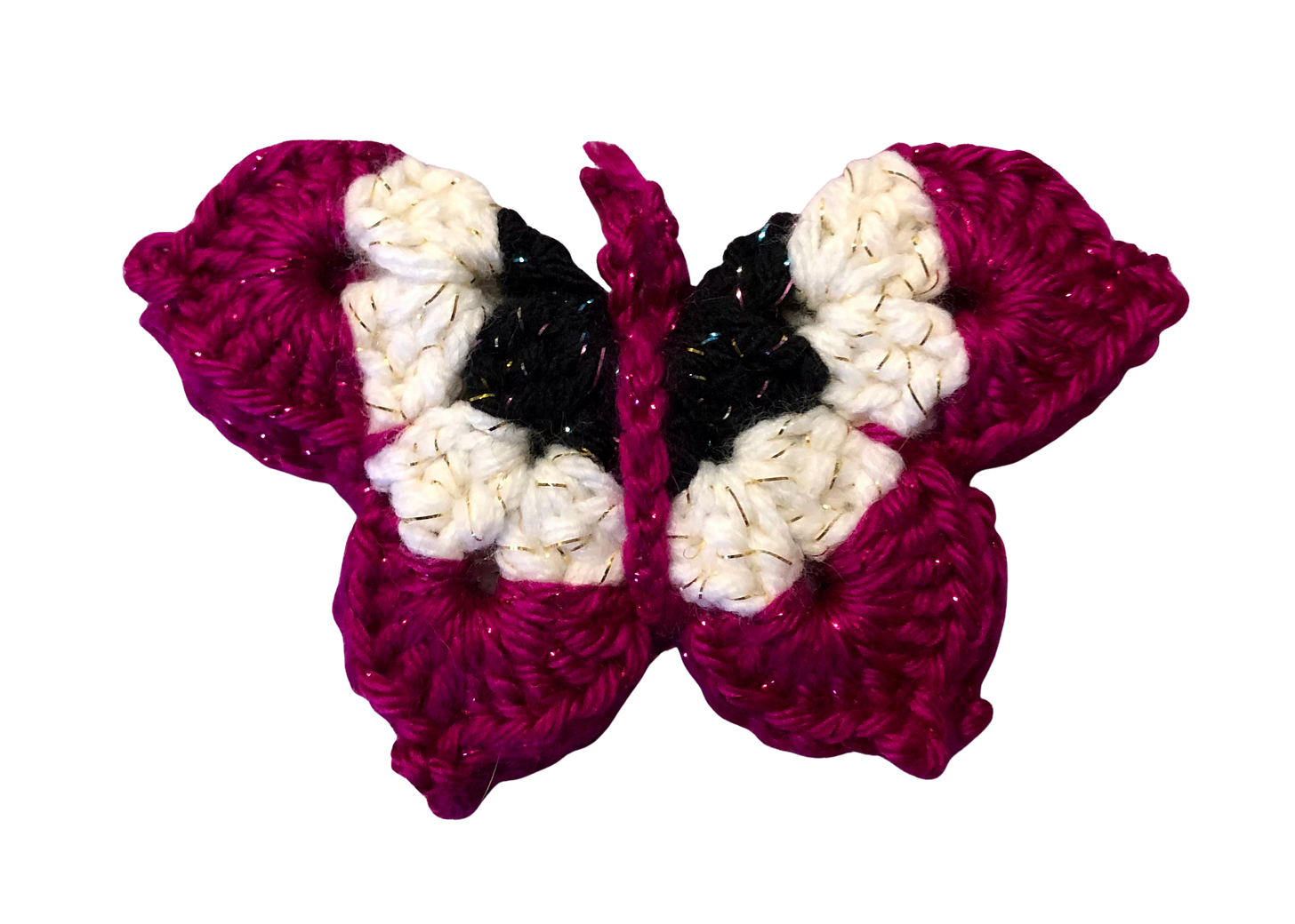 A pink, white, and black crocheted butterfly