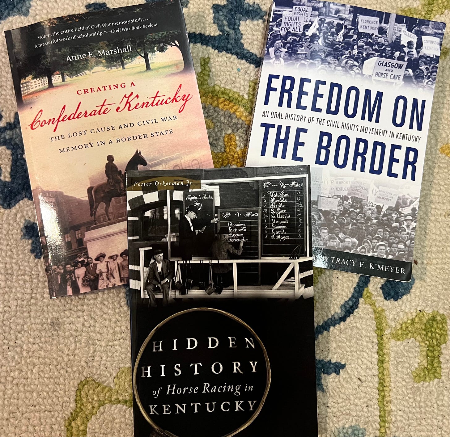 Books (L-R) “Creating a Confederate Kentucky,” “Hidden History of Horse Racing in Kentucky,” and “Freedom on the Border.” Books (L-R) “Creating a Confederate Kentucky,” “Hidden History of Horse Racing in Kentucky,” and “Freedom on the Border.”