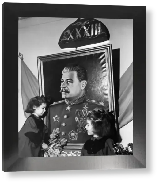 Two Young Girls Adorning Stalin Portrait Print, Moscow, 1950. Art Prints,  Posters & Puzzles from Universal Images Group