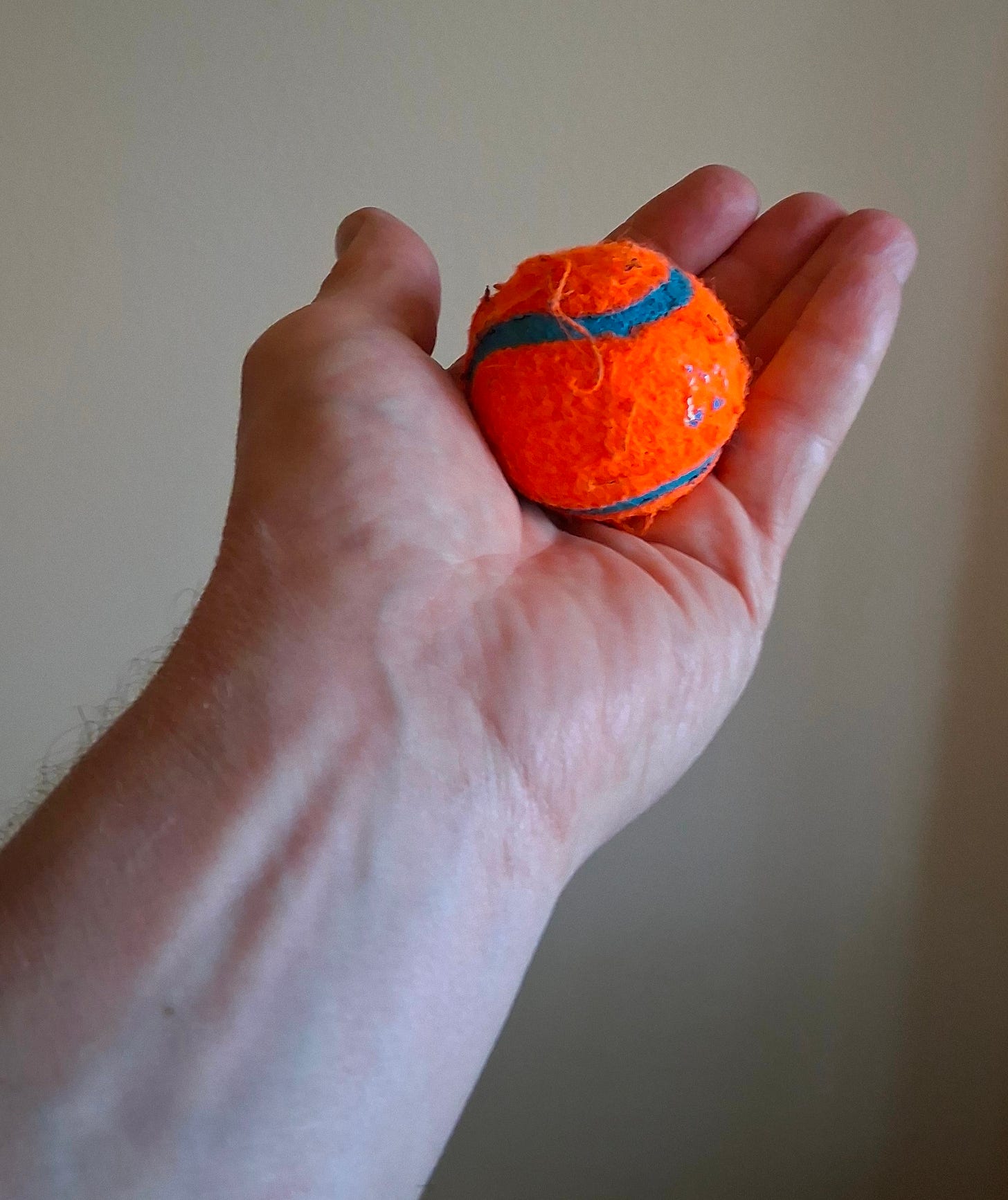 holding a ball palm facing up