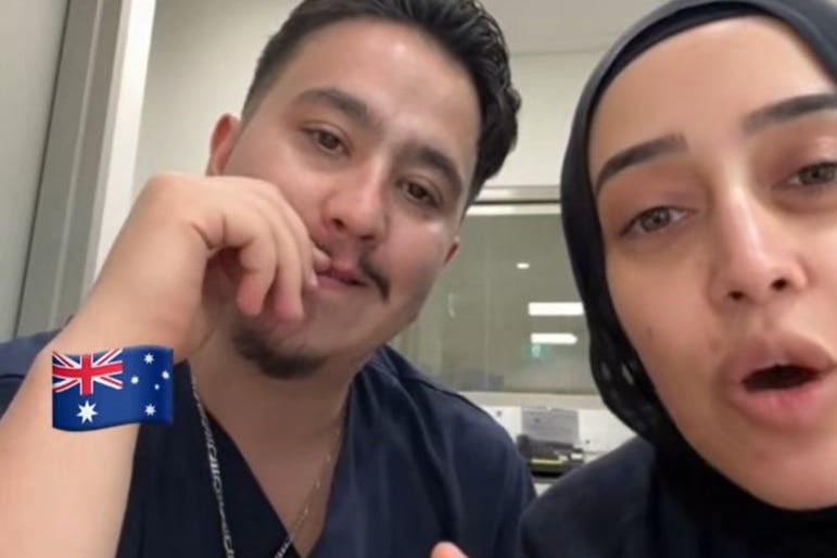 Image of two people, one claiming to be NSW Health worker, talking to content creator