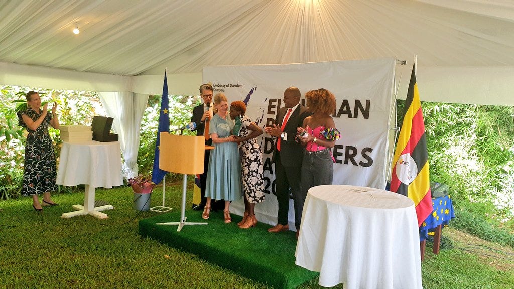 Aloikin Praise Opoloje receives an award from the EU.