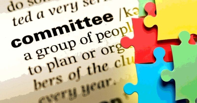 word "committee" and puzzle pieces