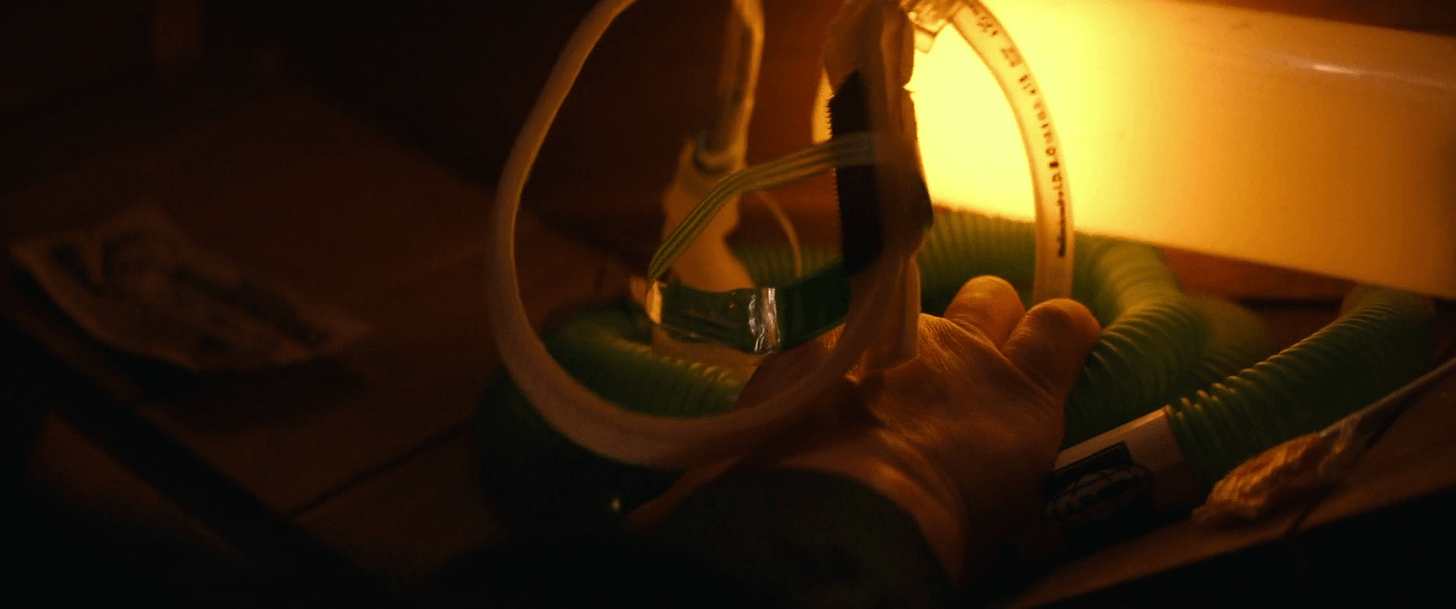 Harmony Cobel reaching for her mother's old breathing tube