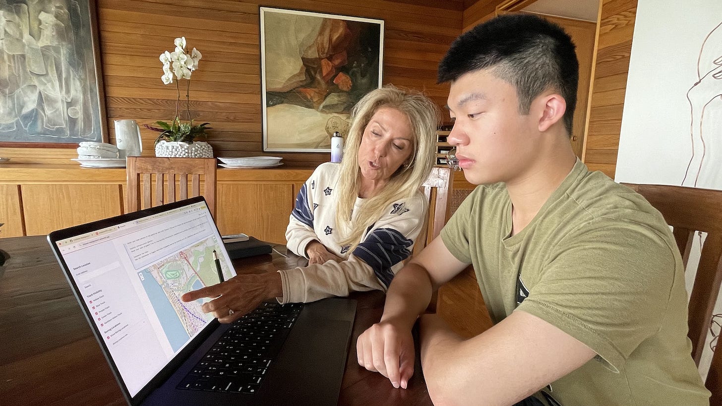 Del Mar resident Angelina Negila, left, and Canyon Crest Academy senior Nathan Qiu look over Qiu’s interactive website detailing the rail realignment options being analyzed by the San Diego Association of Governments. Steve Puterski photo
