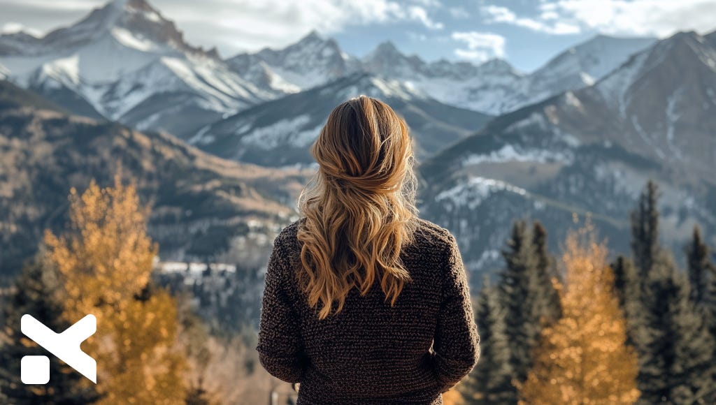 woman-executive-looking-at-the-mountains-the-executive-designer-blog
