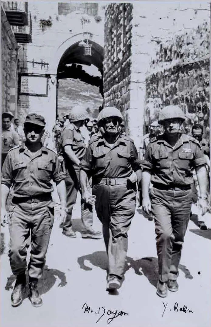Moshe Dayan and Yitzhak Rabin helmeted in the alleyways of the Old City, June 1967.