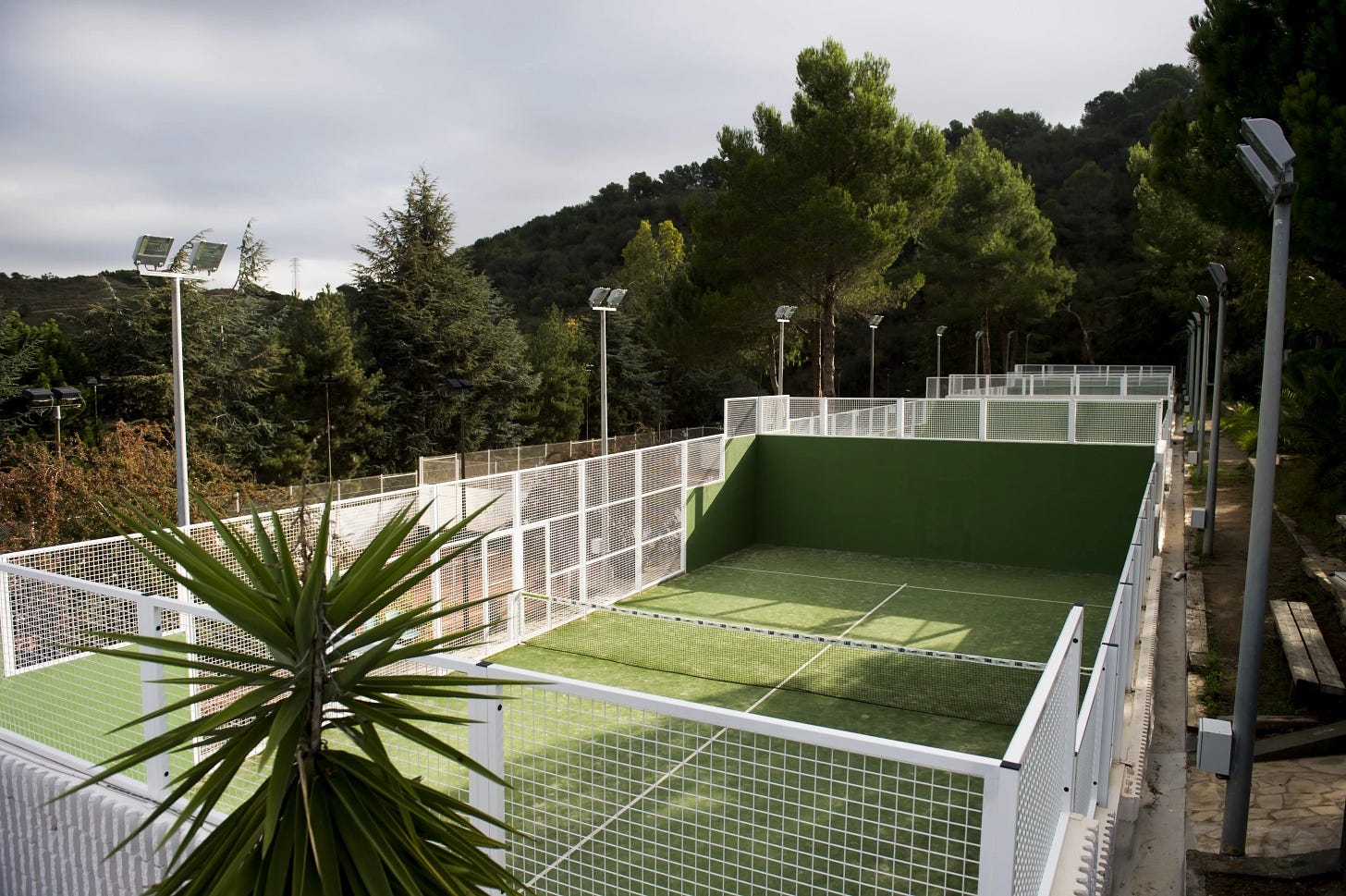 Padel court with concrete walls instead of glass