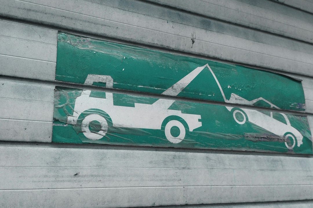 a green and white sign on the side of a building