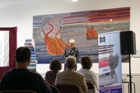 9 images from literary events in Medway. People reading from their books, people watching writers reading from their books. 