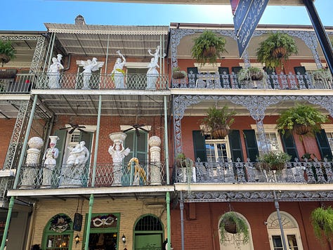 Images of New Orleans' French Quarter + swamp, including iconic balconies dripping in ferns, a swamp gator near Slidell, Jordan in front of blue doors, a cemetary and two tarot card spreads.
