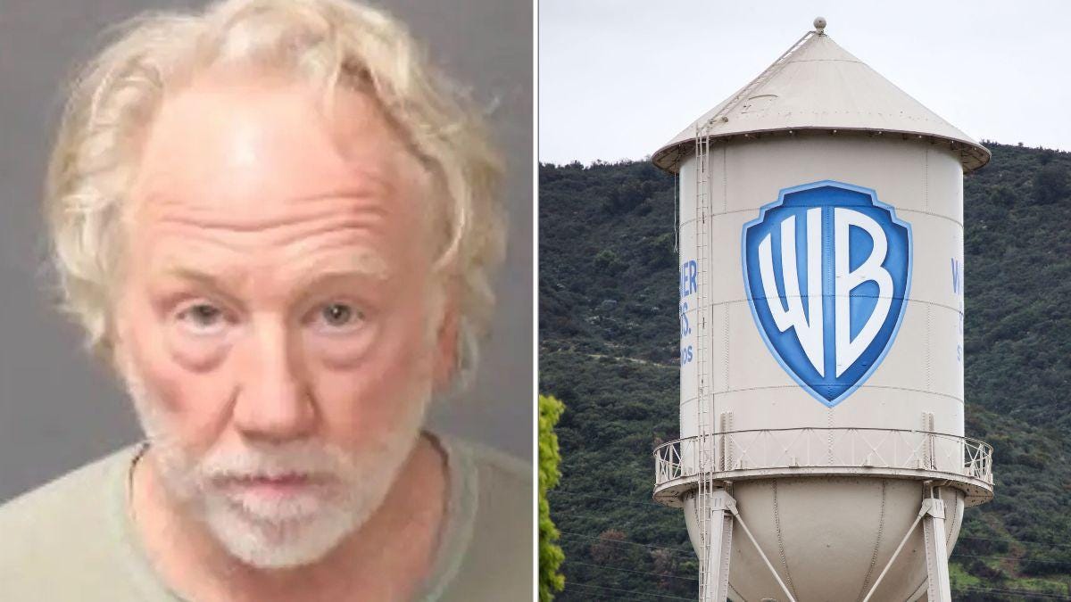 A photo of Timothy Busfield alongside the Warner Bros. logo on a water tower A photo of Timothy Busfield alongside the Warner Bros. logo on a water tower