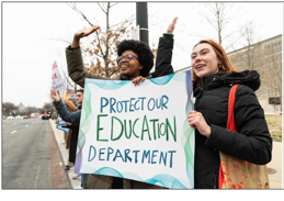 A group of people holding a sign

AI-generated content may be incorrect.