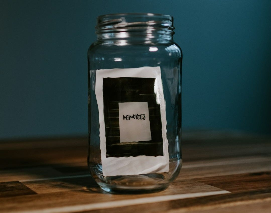clear glass jar on brown wooden table