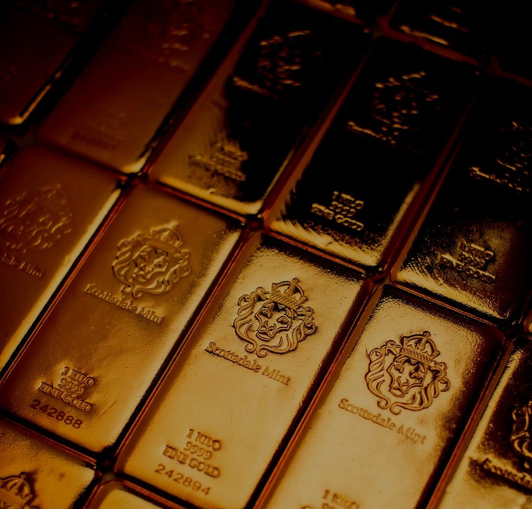 A pile of gold bars sitting on top of a table