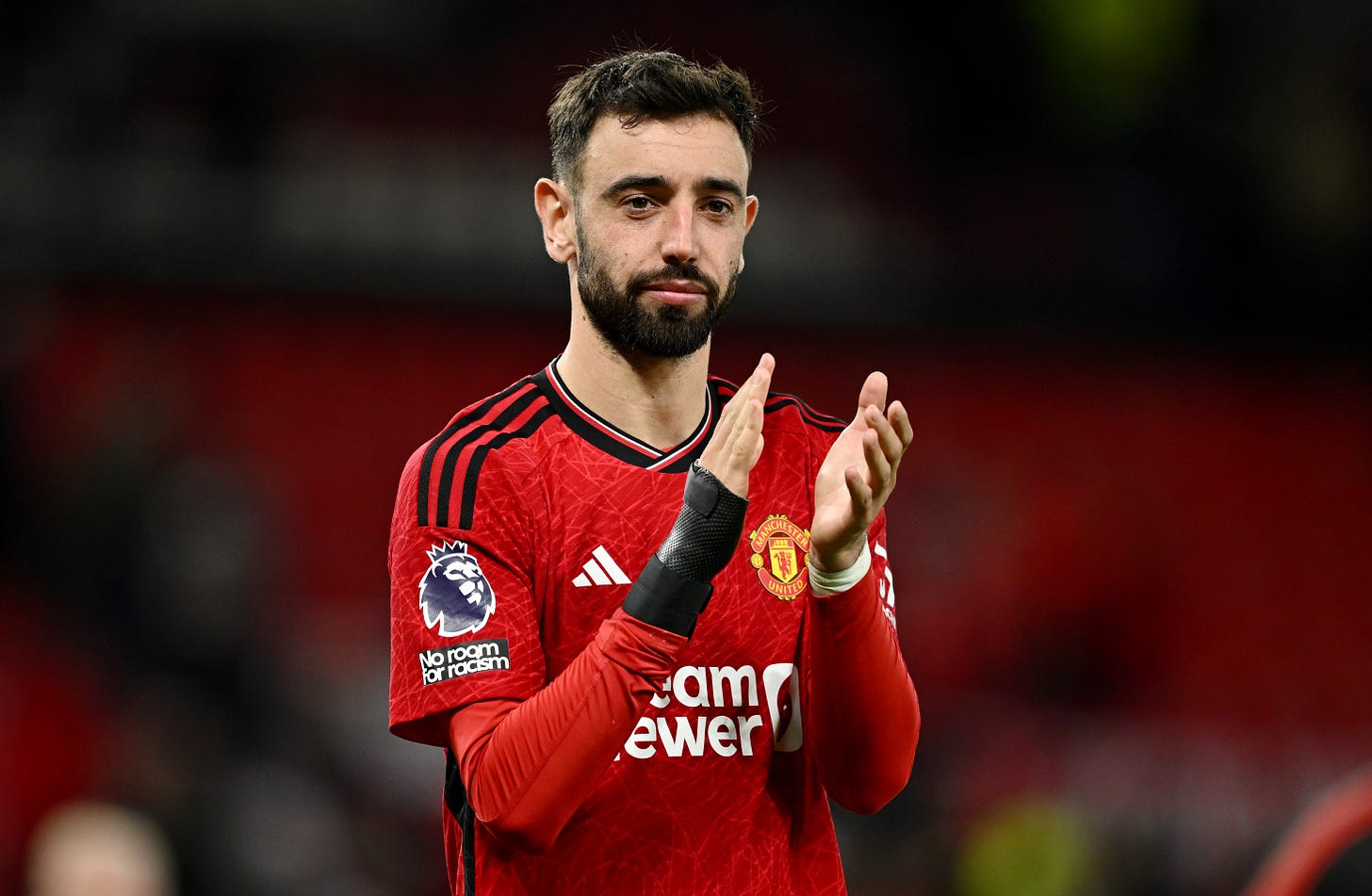 Bruno Fernandes pictured applauding Manchester United fans at Old Trafford following a 3-2 win over Newcastle in May 2024