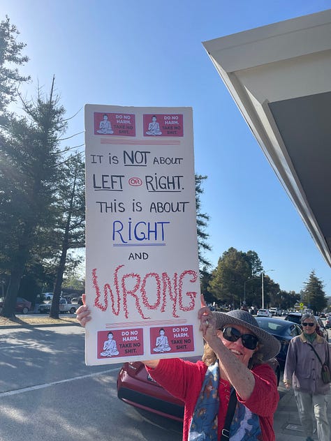 Protestors holding signs