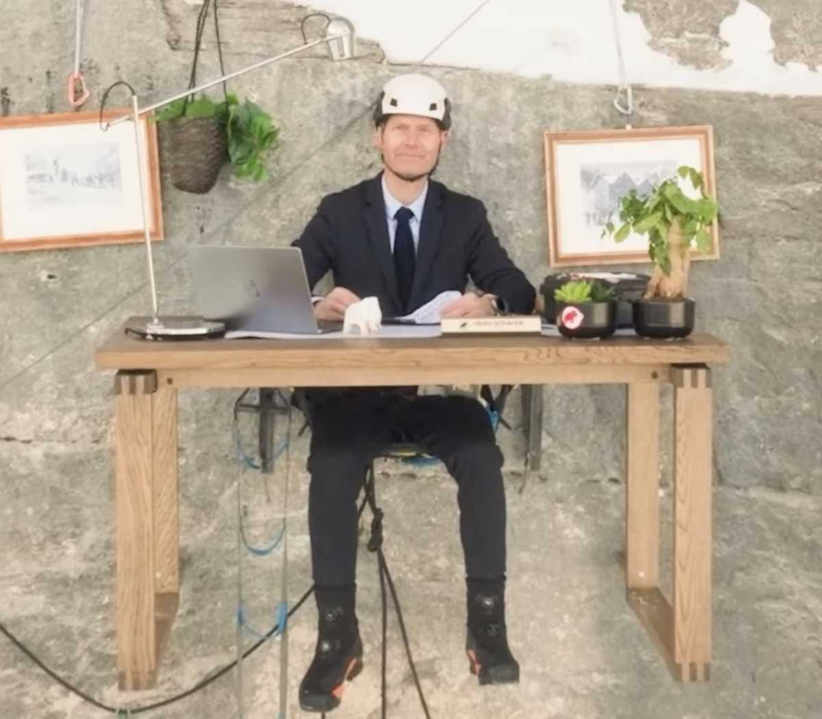 Mammut's CEO works from the side of a cliff. Mammut's CEO works from the side of a cliff.
