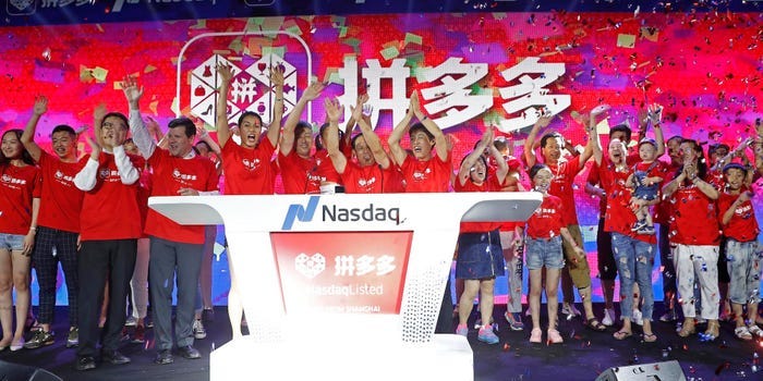 SHANGHAI, CHINA - JULY 26: Pinduoduo users attend the company's listing ceremony at Shanghai Tower on July 26, 2018 in Shanghai, China. Chinese online group discounter Pinduoduo Inc. (PDD) was listed on the Nasdaq Stock Market on Thursday. (Photo by Yin Liqin/China News Service/Visual China Group via Getty Images) SHANGHAI, CHINA - JULY 26: Pinduoduo users attend the company's listing ceremony at Shanghai Tower on July 26, 2018 in Shanghai, China. Chinese online group discounter Pinduoduo Inc. (PDD) was listed on the Nasdaq Stock Market on Thursday. (Photo by Yin Liqin/China News Service/Visual China Group via Getty Images)