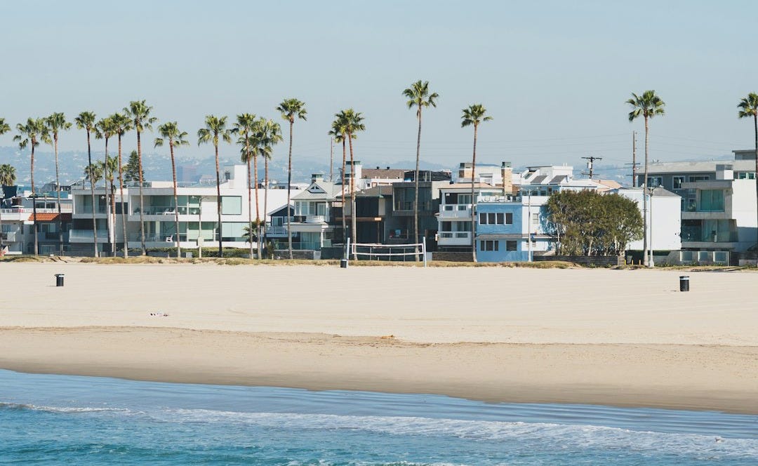 white and brown boat on sea during daytime white and brown boat on sea during daytime