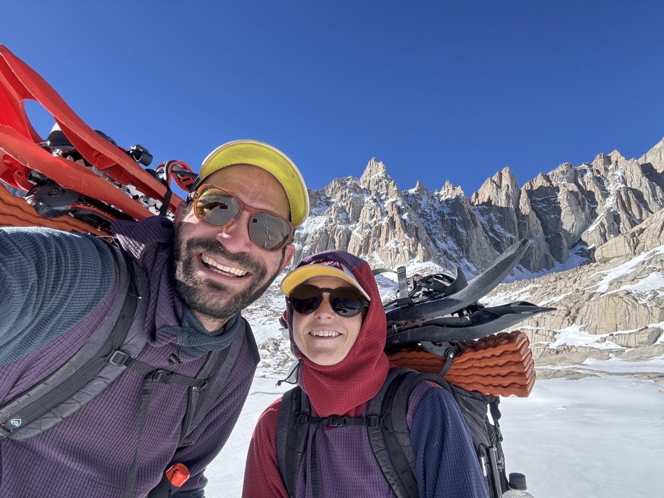 Renee and Tim wearing their favorite mid-layers.