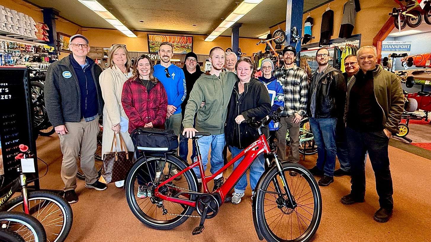 May be an image of bicycle and text