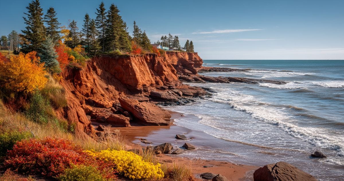 Red cliffs of Prince Edward Island in the fall with autumn trees and Atlantic Ocean view