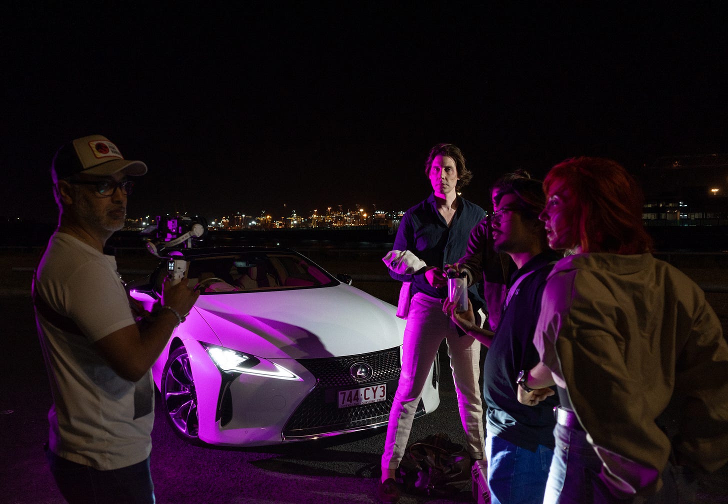 The team standing around discussing the next set of shots to create.