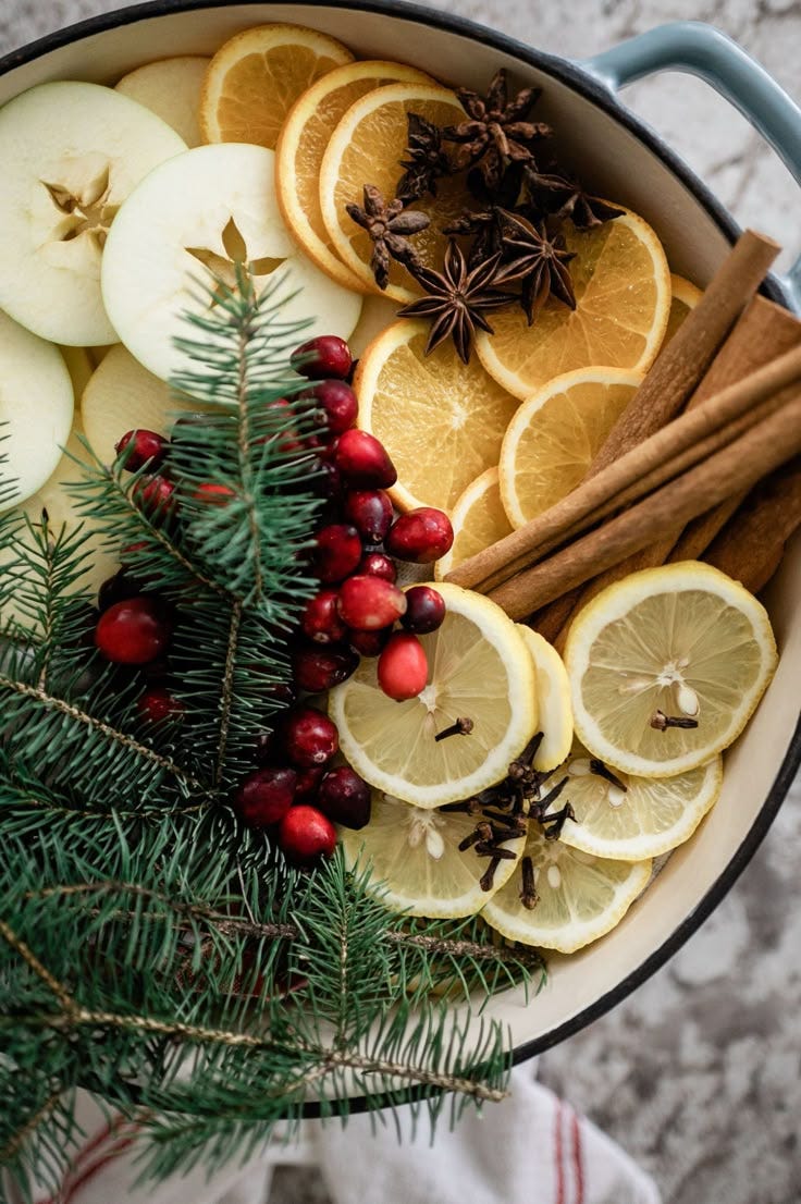 This may contain: an assortment of fruits and spices in a pot