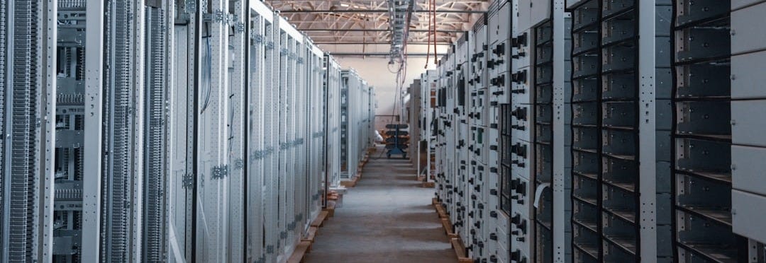 brown wooden hallway with gray metal doors brown wooden hallway with gray metal doors