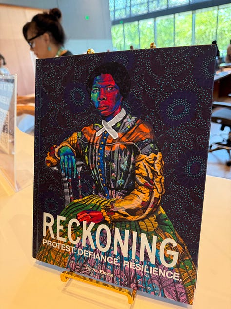 Pictures from a 2025 summer visit to the National Museum of African American History. It includes photos from exhibitions including Mahalia Jackson, the building itself and a book for sale titled "Reckoning" with an artful image of Harriet Tubman. Always work to educate and share the truth.