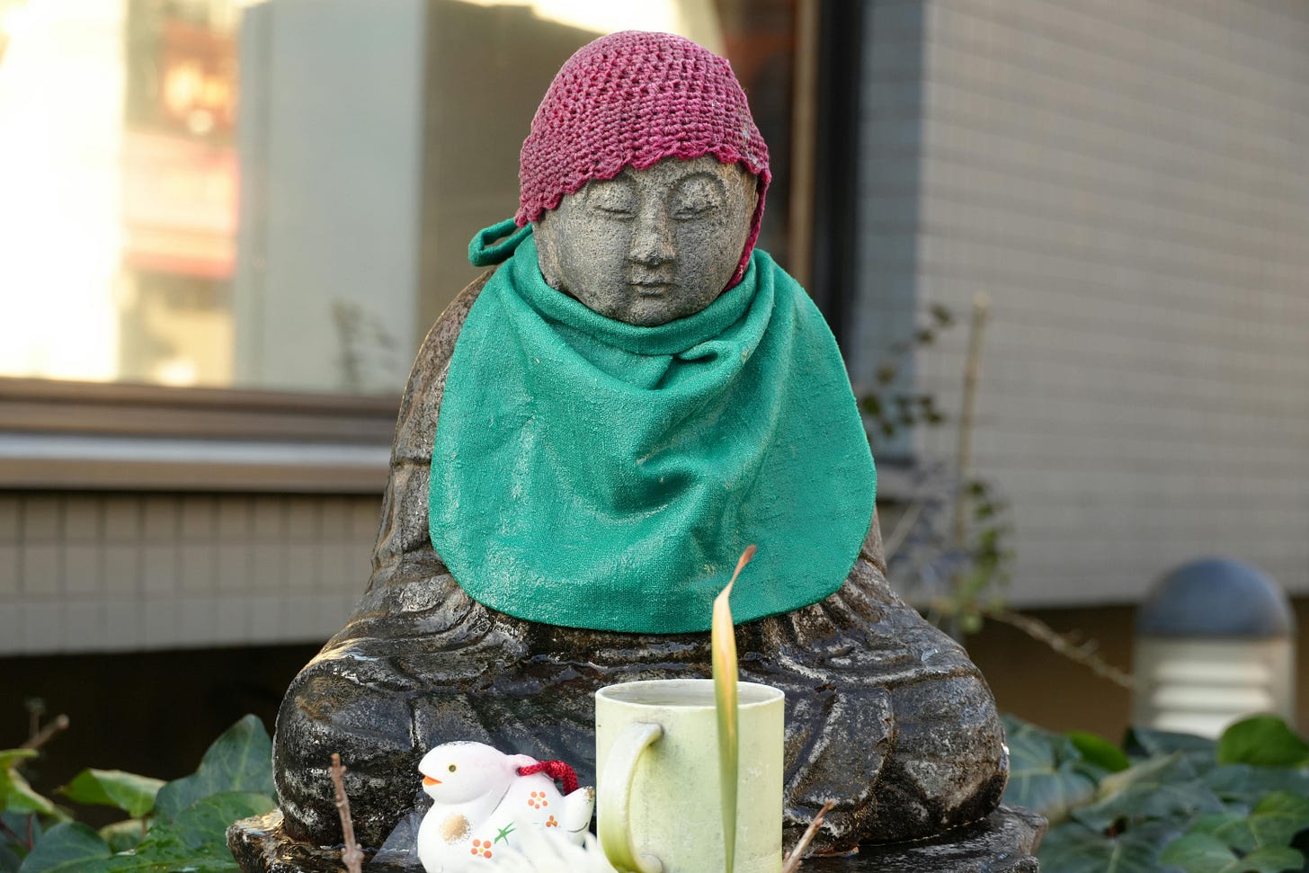 Buddha statue with a bib on. Buddha statue with a bib on.