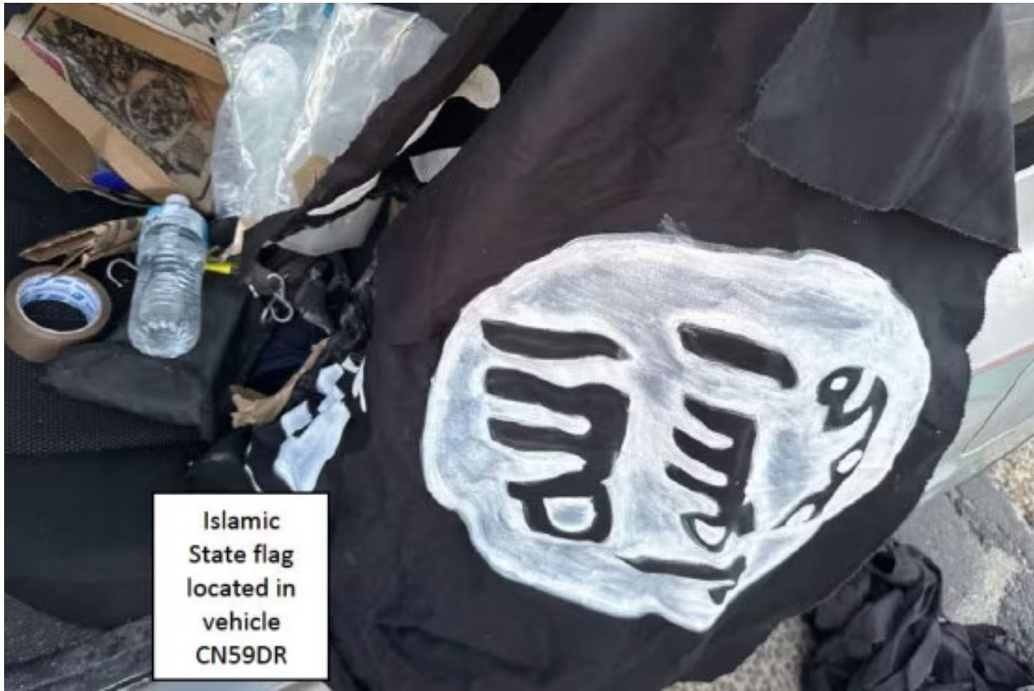 There was a homemade Islamic State flag in the back of the car driven by Bondi gunmen. (Supplied: NSW Local Court)