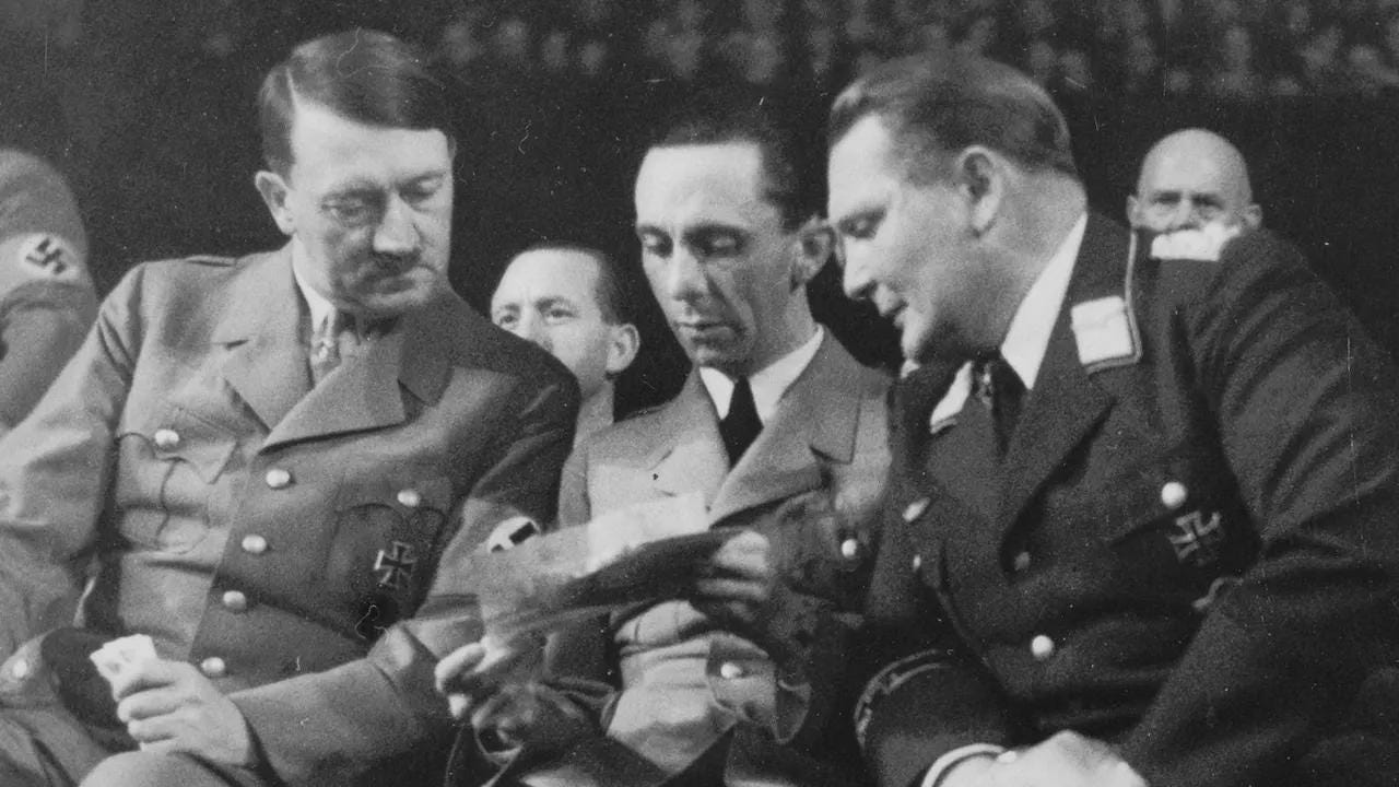 Adolf Hitler, Joseph Goebbels, and Hermann Goering at the opening of the Nazi Party's 1936-37 Winter Relief campaign in Berlin. Adolf Hitler, Joseph Goebbels, and Hermann Goering at the opening of the Nazi Party's 1936-37 Winter Relief campaign in Berlin.