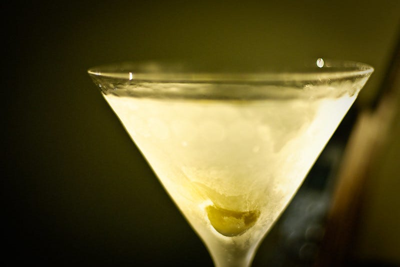 Dirty Martini against a blurred vignette background
