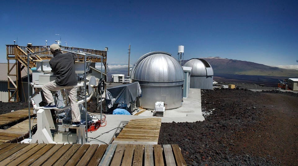 A scientist works at Hawaii's Mauna Loa Observatory at 3396 meters (11,141 feet).