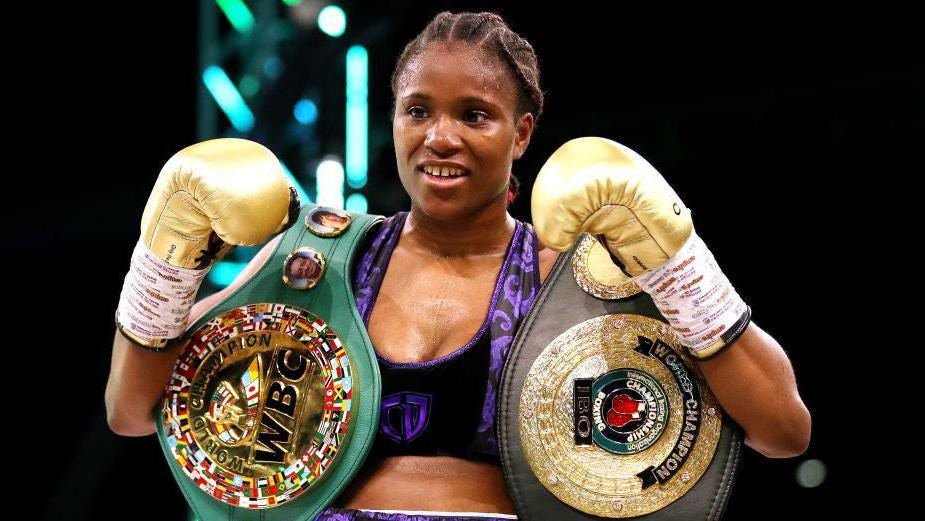 Caroline Dubois posing with the WBC and IBO belts Caroline Dubois posing with the WBC and IBO belts