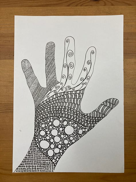 three drawings in black ink. One a sort of oval shape with different elements, one a hand shape filled with shapes, and another streaming lines down the page.