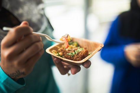 “Chefs from Aramark Collegiate Hospitality showcasing coastal-inspired dishes at the NC Seafood Festival 2025 — including seafood risotto, crab gumbo, and fried shrimp tacos — during live cooking demos and tastings with festival guests.”