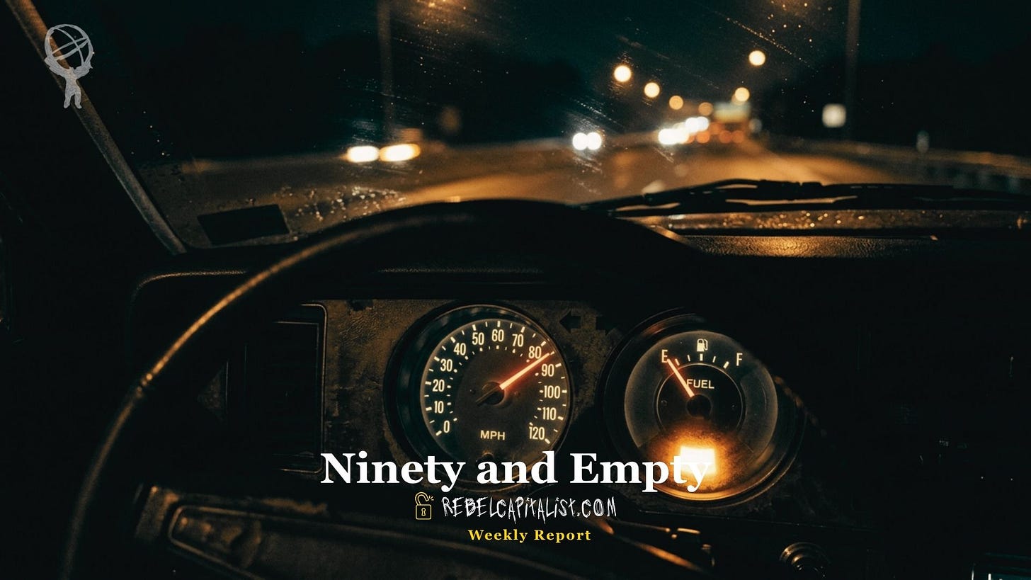 Car dashboard at night showing speedometer at 90 MPH and empty fuel gauge