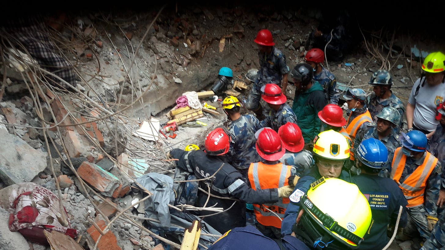  The USAID Disaster Assistance Response Team (DART) rescues a teen in Nepal five days after a magnitude 7.8 earthquake struck central Nepal, affecting more than 8 million people and causing widespread damage and destruction. [USAID Photo]