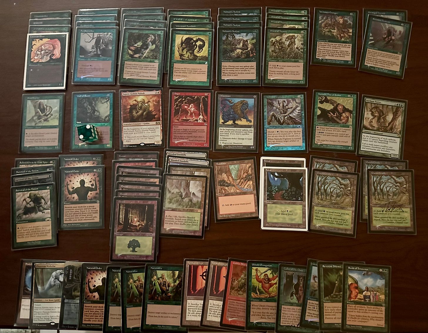 Decklist:
Main Deck
4 Llanowar Elves
4 Fyndhorn Elves
4 Quirion Ranger
4 Wirewood Symbiote
4 Multani’s Acolyte
4 Priest of Titania
1 Yavimaya Granger
2 Deranged Hermit
1 Druid Lyrist
2 Wall of Roots
1 Squee, Goblin Nabob
1 Anger
1 Masticore
1 Nantuko Vigilante
1 Kamahl, Fist of Krosa
4 Survival of the Fittest
2 Natural Order
1 Verdant Force
4 Wooded Foothills
4 Gaea’s Cradle
1 Mountain
9 Forest
Sideboard
3 Naturalize
1 Reverent Silence
1 Seeds of Innocense
2 Tormod’s Crypt
1 Stabilizer
2 Natural Order
1 Phantom Nishoba
1 Uktabi Orangutan
1 Goblin Sharpshooter
1 Caller of the Claw
1 Genesis Decklist:
Main Deck
4 Llanowar Elves
4 Fyndhorn Elves
4 Quirion Ranger
4 Wirewood Symbiote
4 Multani’s Acolyte
4 Priest of Titania
1 Yavimaya Granger
2 Deranged Hermit
1 Druid Lyrist
2 Wall of Roots
1 Squee, Goblin Nabob
1 Anger
1 Masticore
1 Nantuko Vigilante
1 Kamahl, Fist of Krosa
4 Survival of the Fittest
2 Natural Order
1 Verdant Force
4 Wooded Foothills
4 Gaea’s Cradle
1 Mountain
9 Forest
Sideboard
3 Naturalize
1 Reverent Silence
1 Seeds of Innocense
2 Tormod’s Crypt
1 Stabilizer
2 Natural Order
1 Phantom Nishoba
1 Uktabi Orangutan
1 Goblin Sharpshooter
1 Caller of the Claw
1 Genesis
