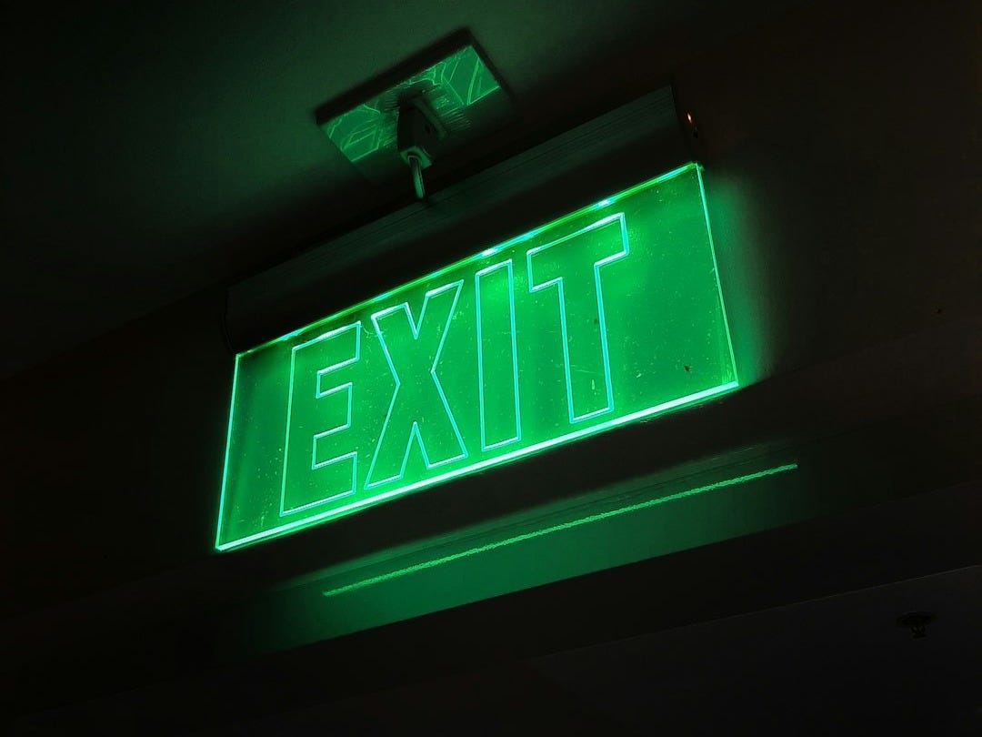 green and white exit sign green and white exit sign