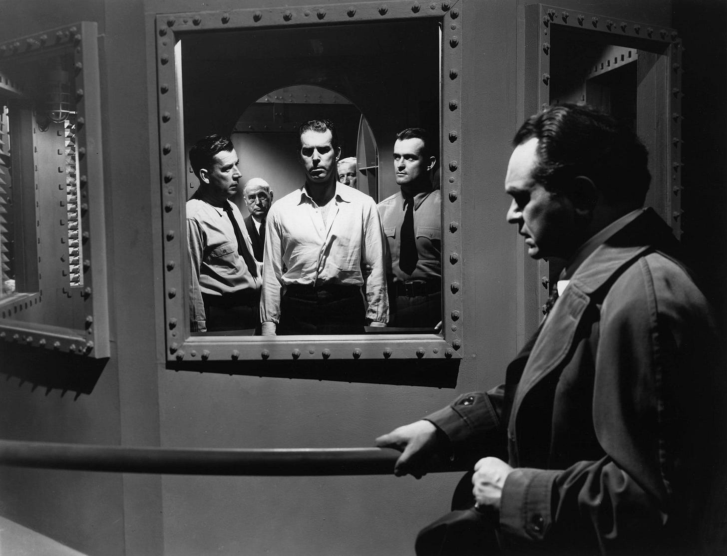 Double Indemnity 1944 - Original ending scene. Wilder shot the scene from  Neff's perspective, looking out of the gas chamber at Keyes. Wilder shot  for five days and spent $150,000 on the