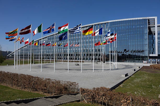 A building with many flags
AI-generated content may be incorrect.